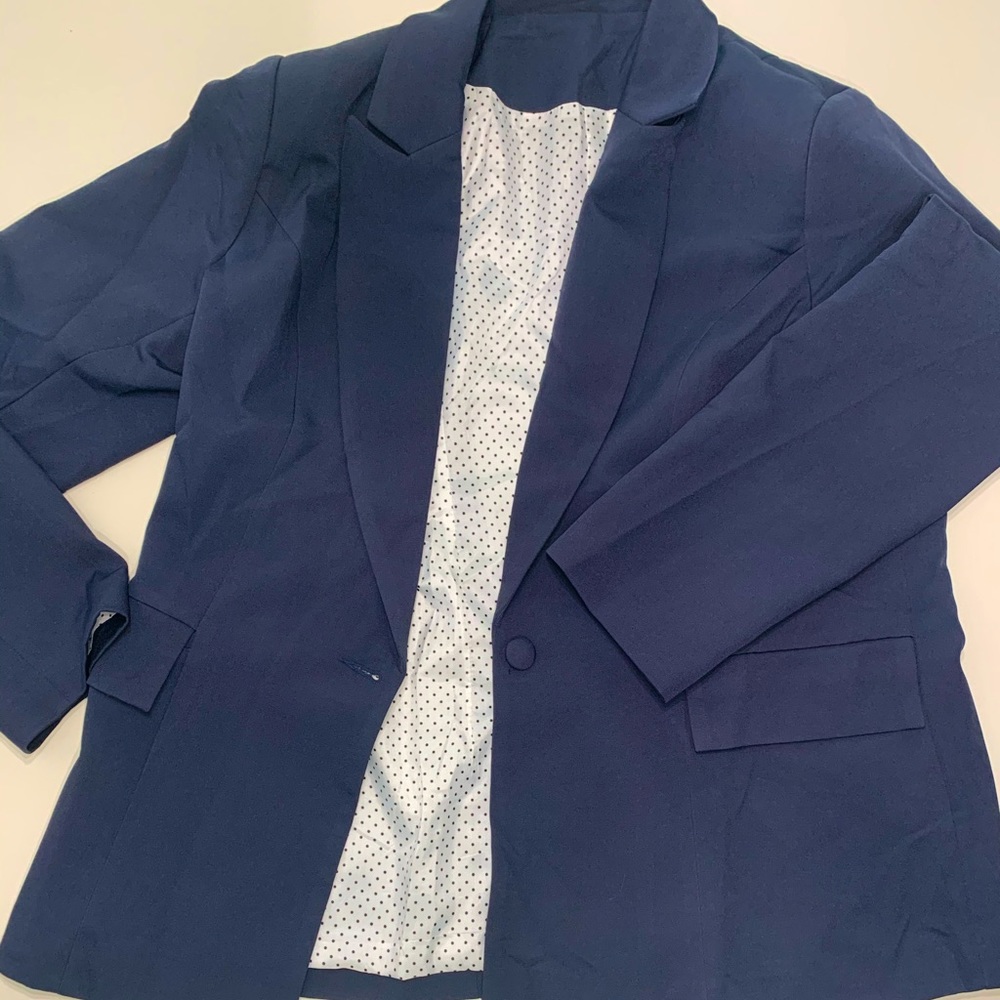 Navy Blazer with polka dot lining.